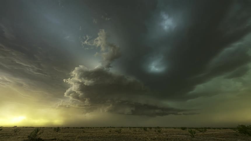 Rainstorm clouds rolling over the plains at evening