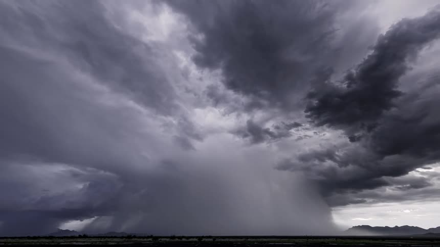 A lightning storm with cloudy skies during the day