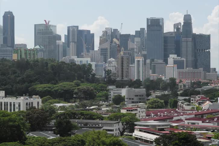 Timelapse showing a Skyscraper constructed at edge of downtown city