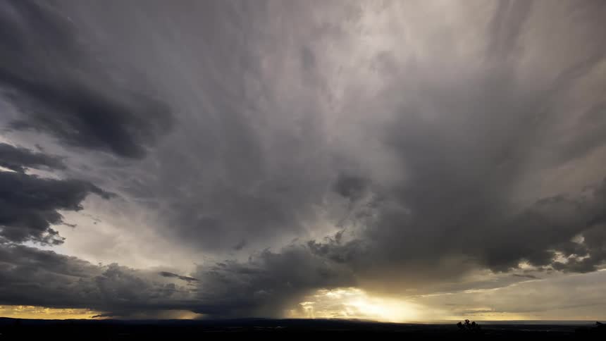 Cloudy sky with sunbeams during the evening