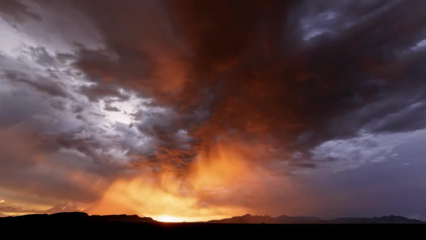 Cloudy sky with sunlight illuminating the landscape at dawn