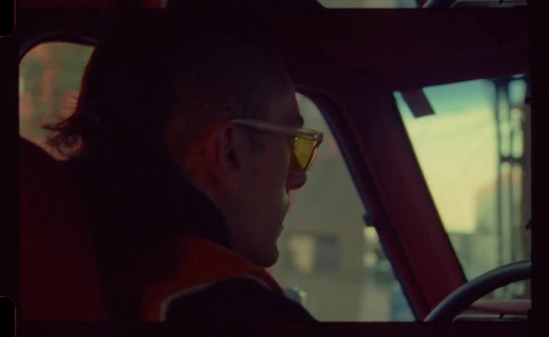 A man is driving through the city