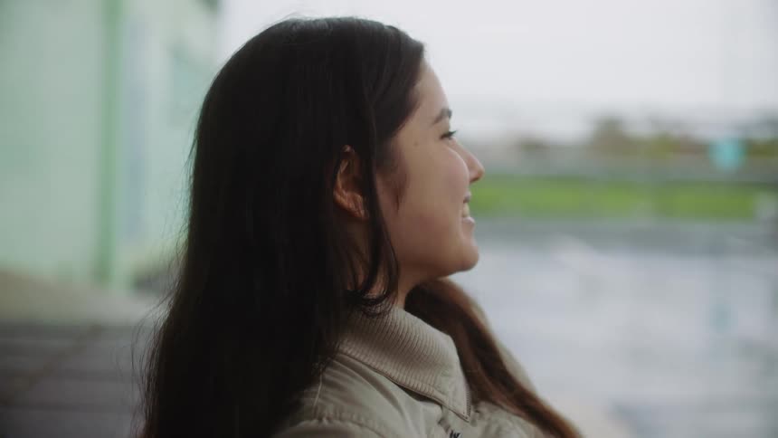 A girl is talking and laughing with a friend