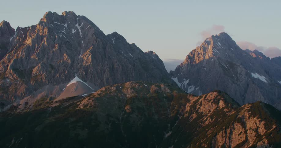 Rocky mountain range with remnants of snow