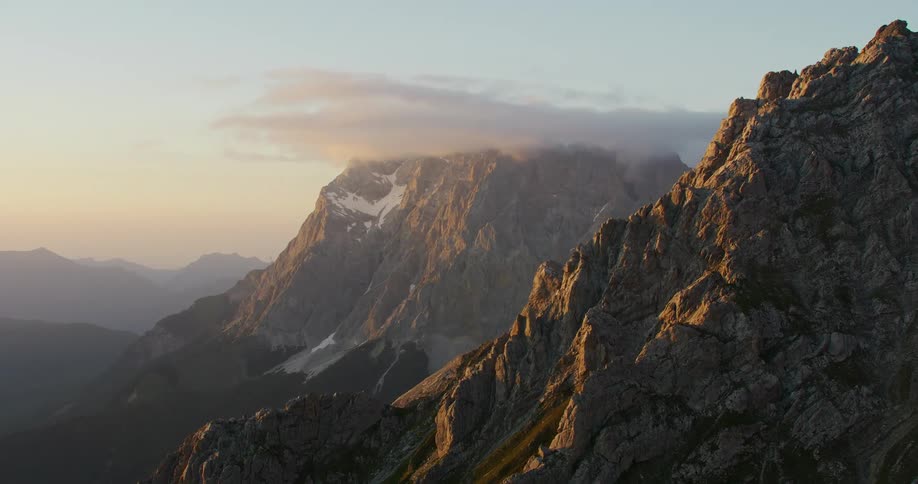Aerial view of peaks and mountains at cloud level