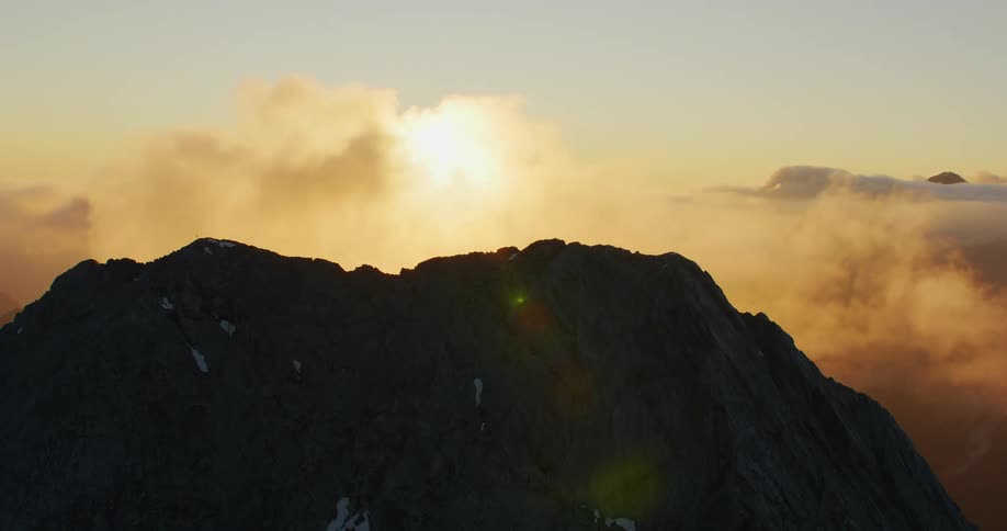 Aerial from the top of the mountain with fog during sunrise