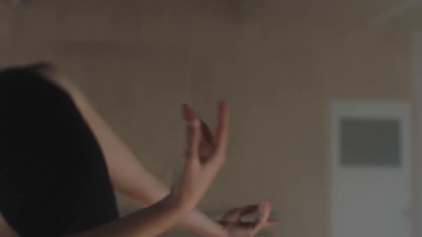 Young woman moving her arms in a dance style