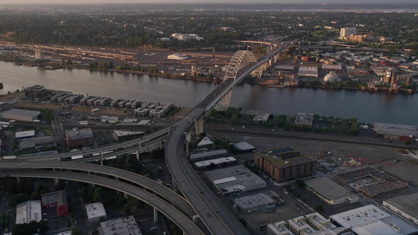 Aerial view of the Fremont Bridge and freeway interchange in downtown Portland Oregon during sunset
