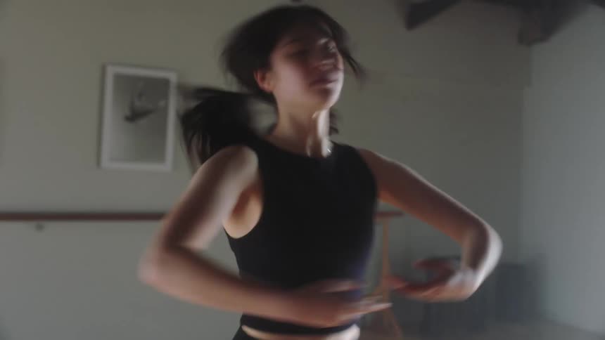 Young woman dancing and leaping in ballet style