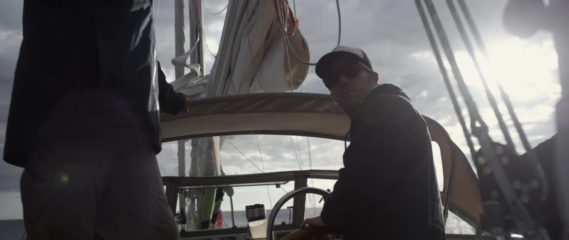 People are on a boat on a cloudy day
