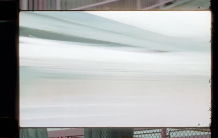 A daytime view of a moving train in motion