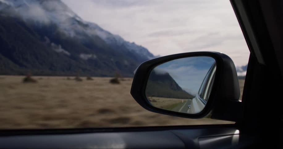 Recording from inside a moving car of icy mountains