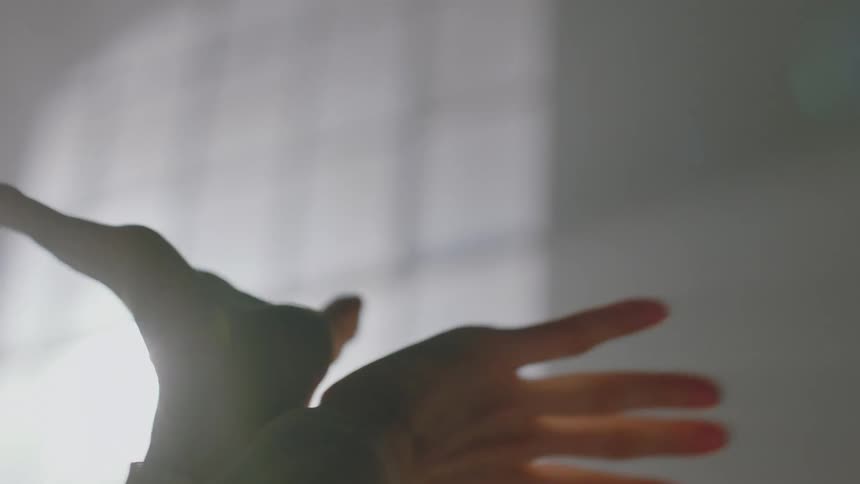 Closeup on the arm and hand of a person dancing