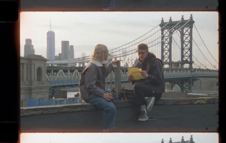 A couple having a drink and gist on the roof top