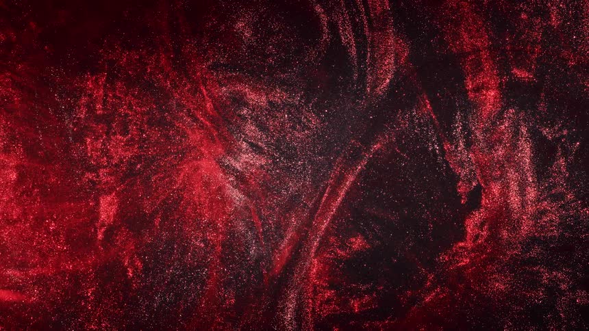 A bright red nebula in a starry galaxy