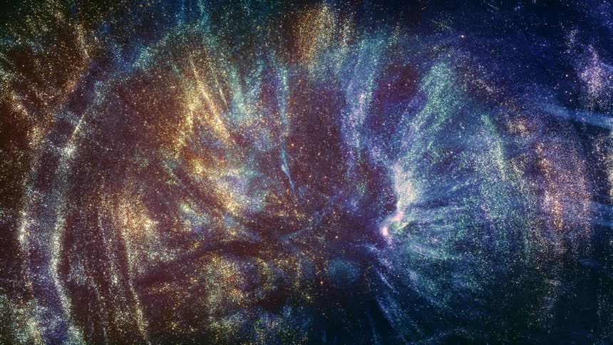 Colorful sparkling substance moving into shapes against a dark background