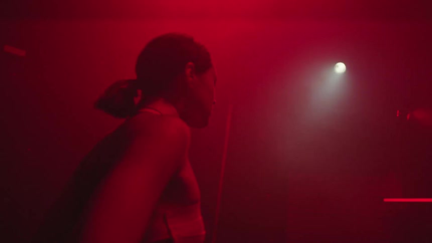 A woman is dancing in the nightclub
