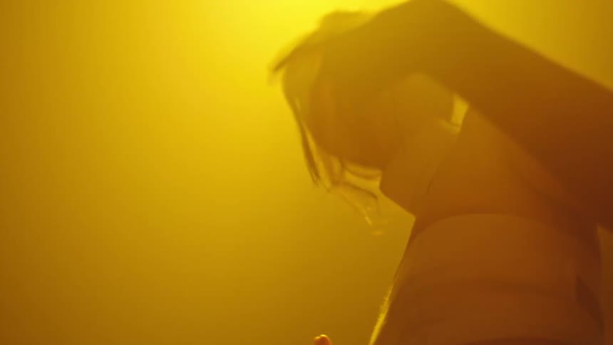 Young woman dancing at a nightclub