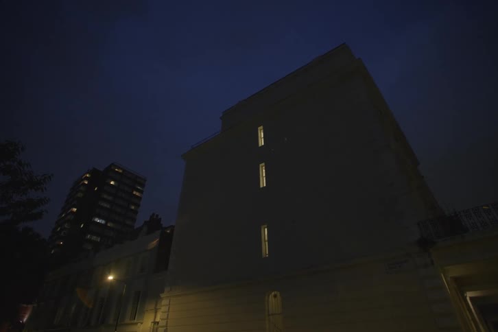 Silhouette of a residential building in the city at night