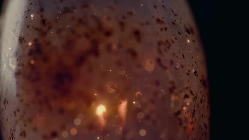 Sparks fly inside a vintage flash bulb