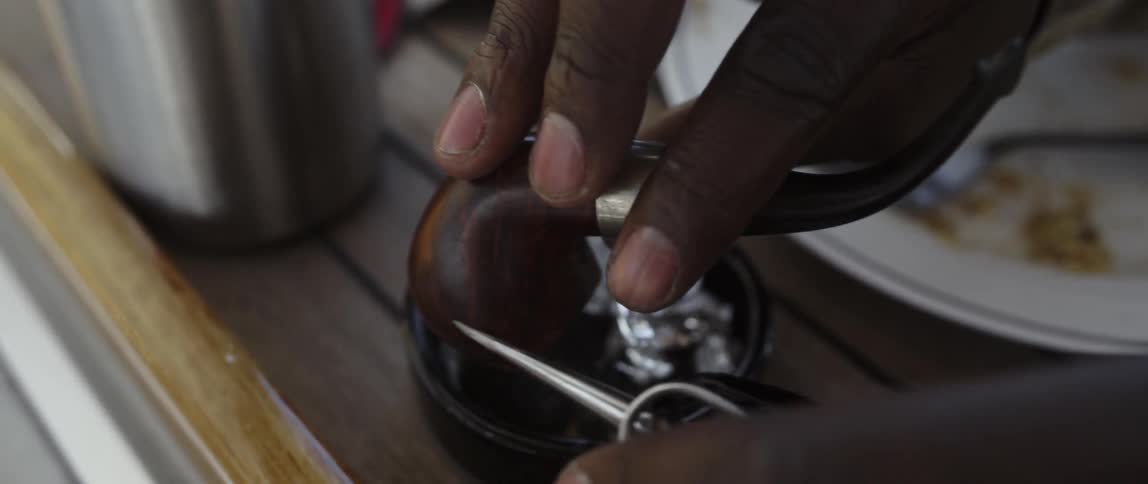 A person cleans out a pipe