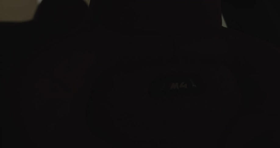 A leather front seat of a car rotates while a light flashes on and off