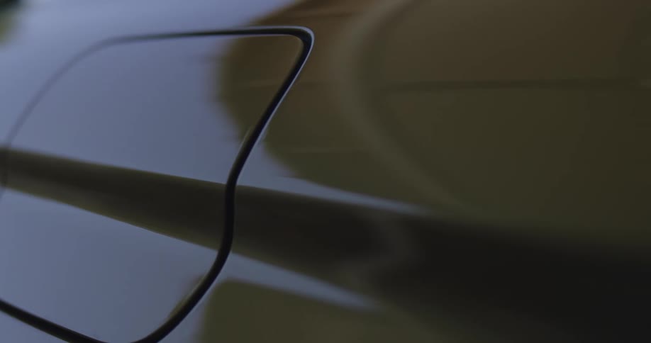 The side panel of the car door is reflective