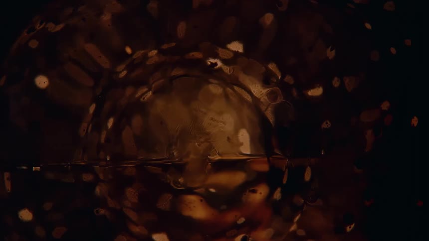 Sparks inside a vintage flash bulb on a dark room