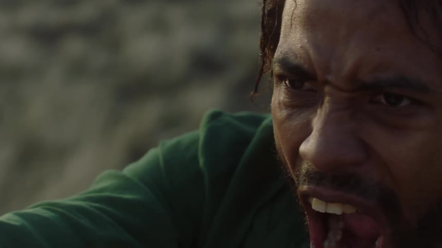 Closeup of a man with a facial expression of strength and discovery making hand movements and shouting