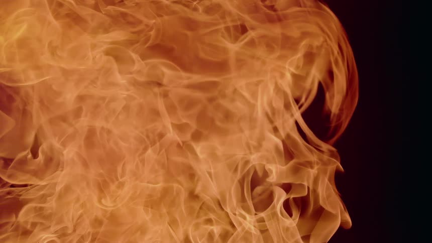 Orange flames rise then dissipate against a dark background