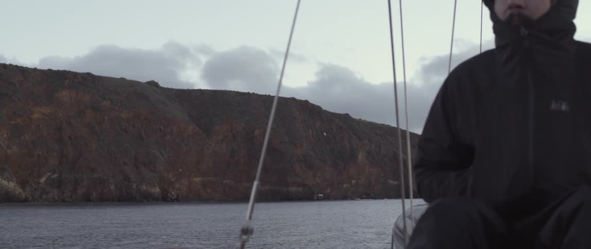 A man riding a boat in a body of water