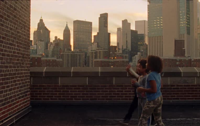 Children throw a glass at the wall on the roof