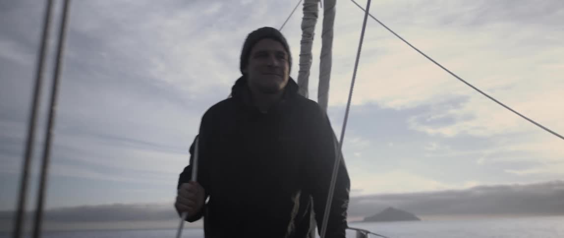 A man is talking on a boat