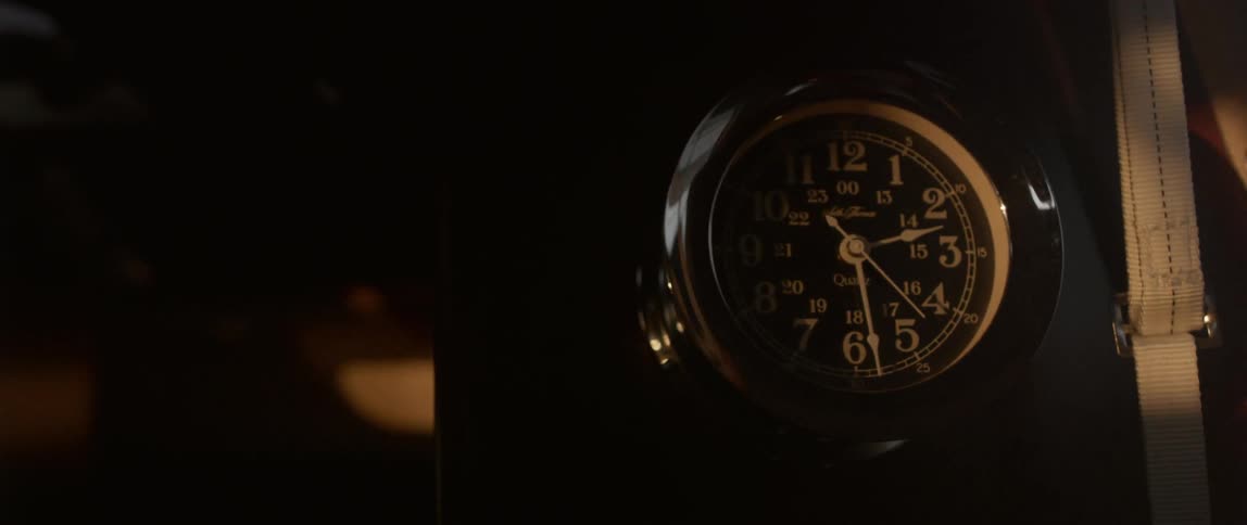 Light shines on a black clock