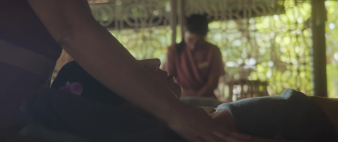 A woman getting a relaxing massage at the spa