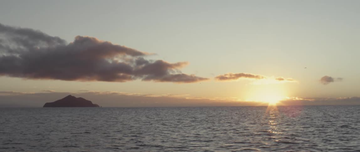 The sun is setting over this large body of water