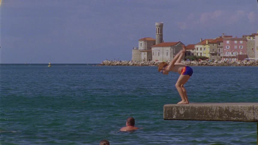 A child jumps into the water
