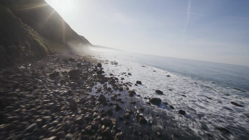 FPV drone view of cliffs and a rocky coastline