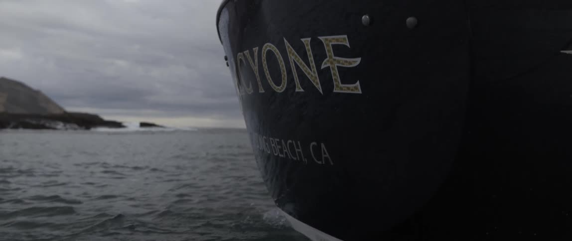 A large boat is sailing on a cloudy day