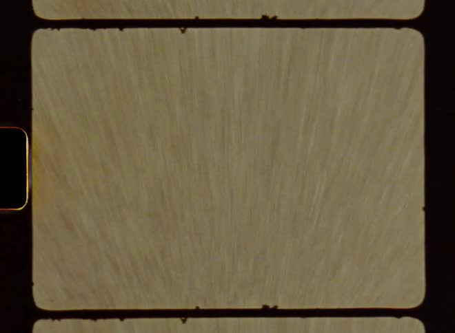 Close up of yellow stripes on a road pavement going by sped up