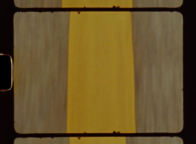 A top view of a road with yellow lines