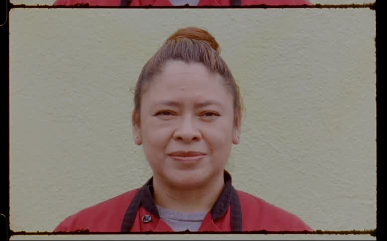 A woman staring straight ahead