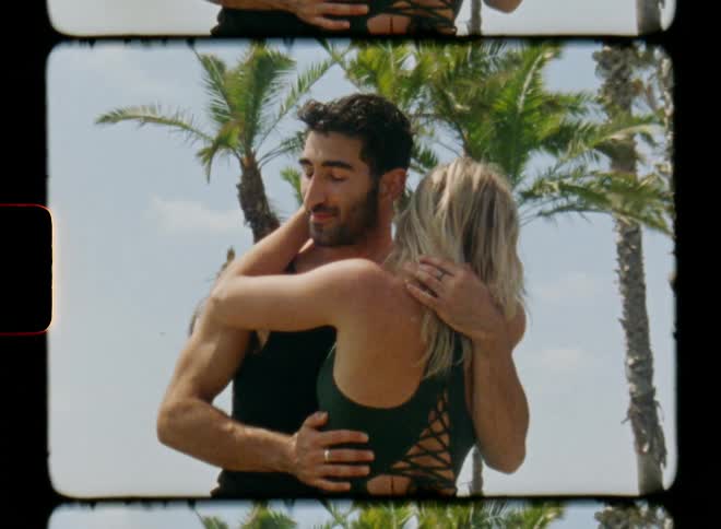 Young couple touch each other while dancing outdoors caught on vintage film