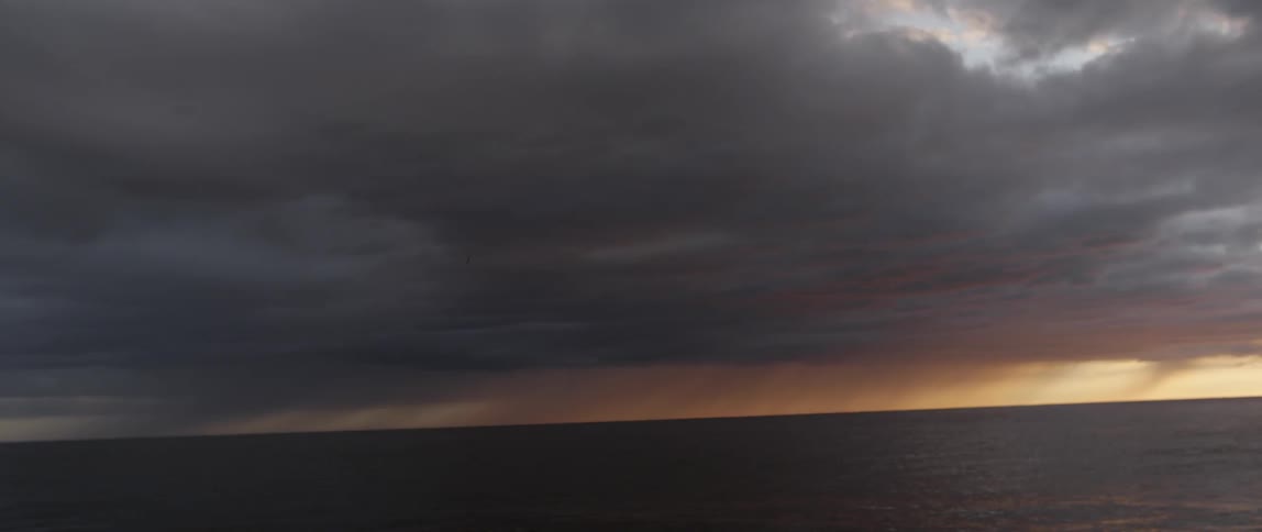 The sky is full of dark clouds at dawn