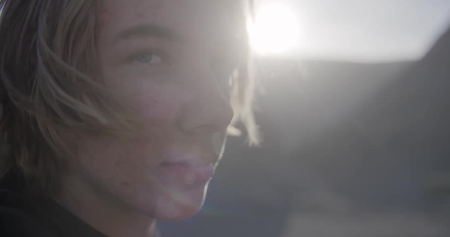 A teenager with a longing look
