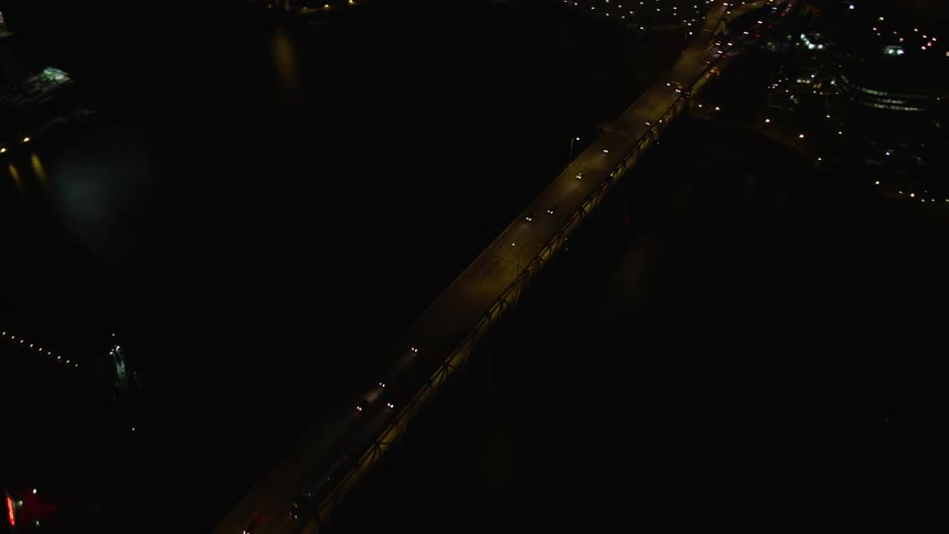 Aerial footage of Marquam Bridge in Downtown Portland Oregon showcasing the city's nighttime metropolis transportation and the beautiful Willamette River