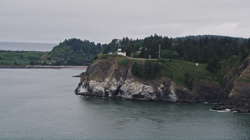 Aerial view of Cape Disappointment Light on seaside cliffs in Washington during summer