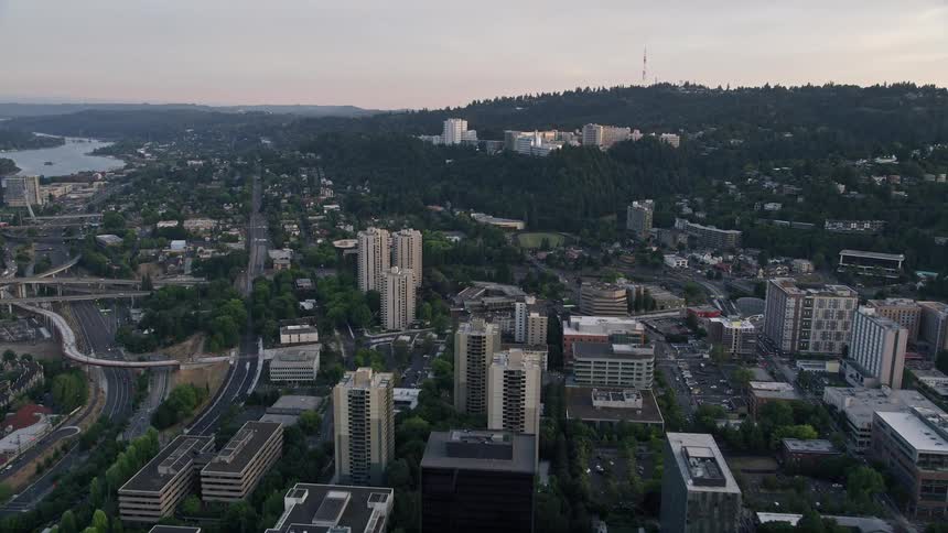 Aerial view of Oregon Health and Science University at sunset in Portland Oregon with partly cloudy skies and a beautiful sunset