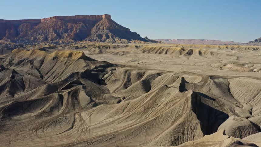 Aerial view of a canyon full of motorcycle tracks