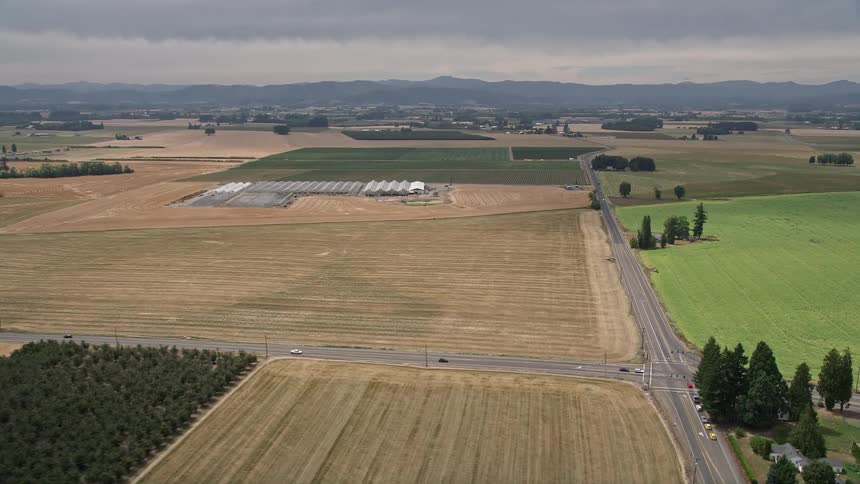 Aerial view of farm fields greenhouses and country roads in Hillsboro Oregon during the summer